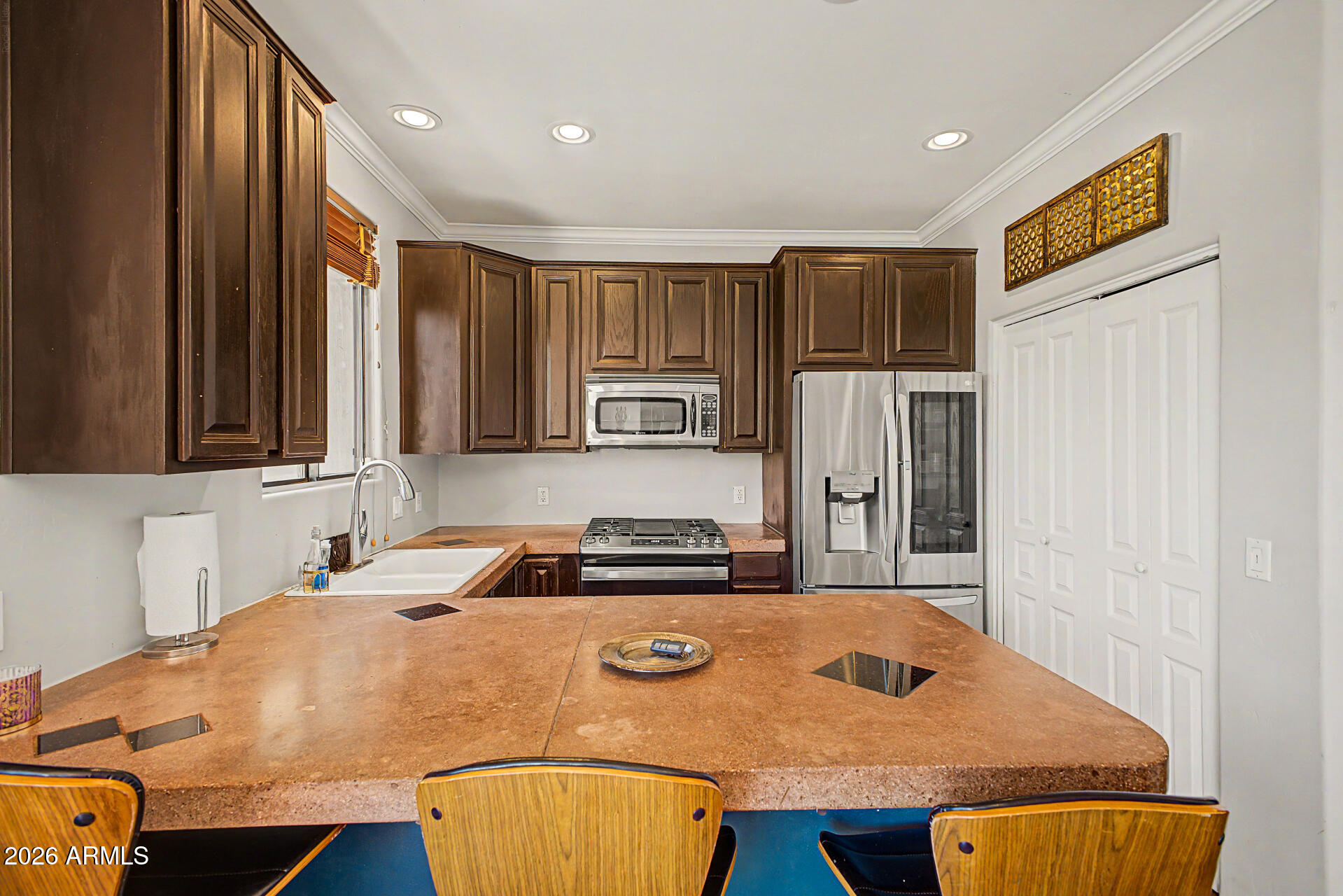10009 North 1st Drive Phoenix, AZ 85021 - Photo 7 of 15 a kitchen with stainless steel appliances granite countertop a sink a stove and a refrigerator