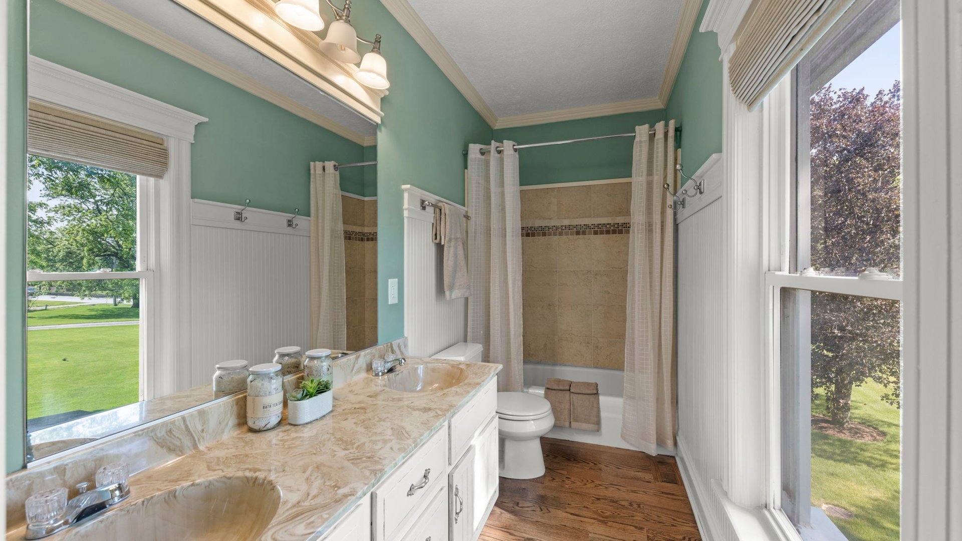 3614 Wolf Road Oswego, IL 60543 - Photo 29 of 56 a bathroom with a granite countertop sink and a mirror