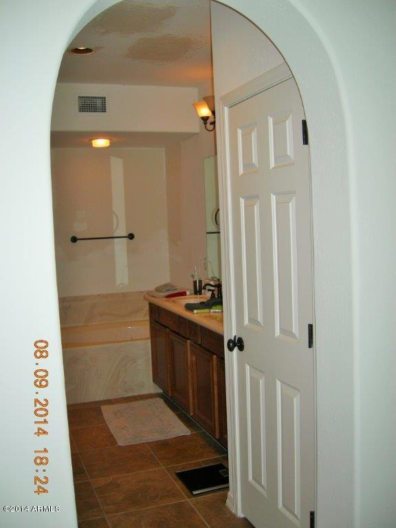 3935 East Rough Rider Road, Unit 1003 Phoenix, AZ 85050 - Photo 17 of 53 Arched hallways