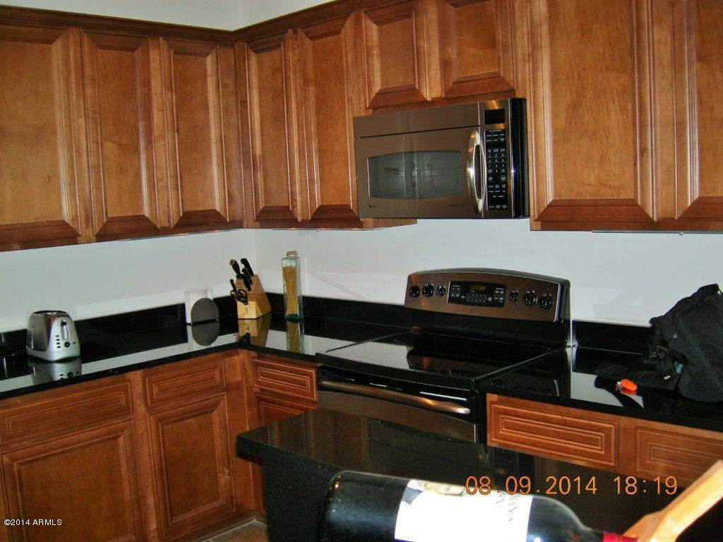 3935 East Rough Rider Road, Unit 1003 Phoenix, AZ 85050 - Photo 20 of 53 Plenty of Storage in kitchen
