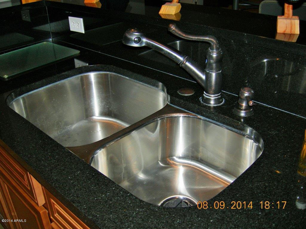 3935 East Rough Rider Road, Unit 1003 Phoenix, AZ 85050 - Photo 22 of 53 Stainless dual sinks in kitchen