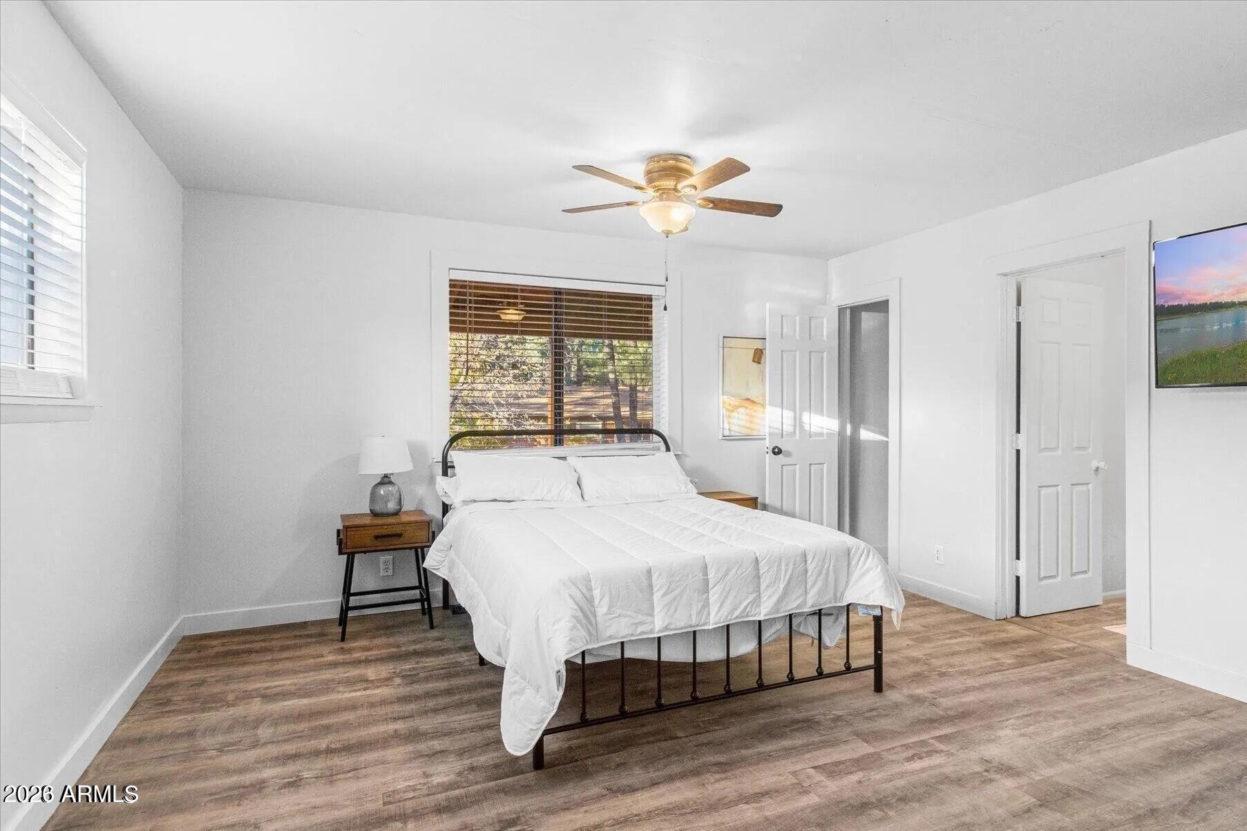 5065 Forest View Road Lakeside, AZ 85929 - Photo 19 of 24 a bedroom with a bed and a table in it