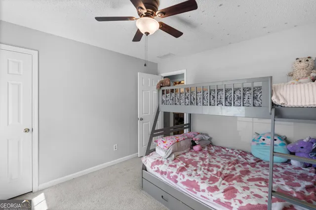 a bed room with a bed and a chandelier