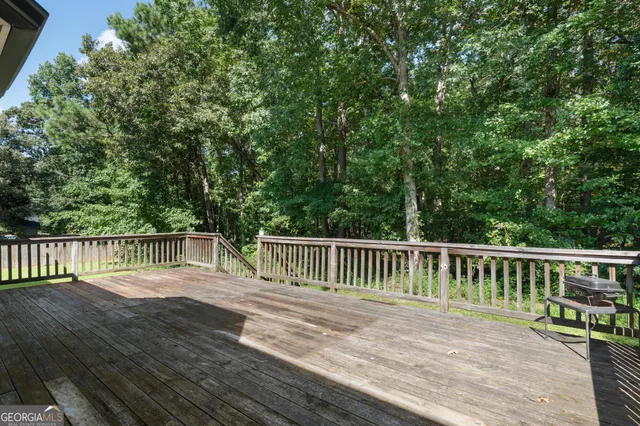 a view of balcony with deck and wooden floor