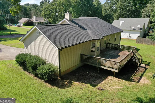 a aerial view of a house with swimming pool and yard view