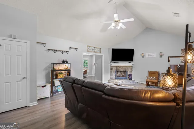 a living room with furniture and a flat screen tv