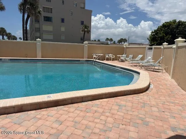a view of swimming pool with a yard