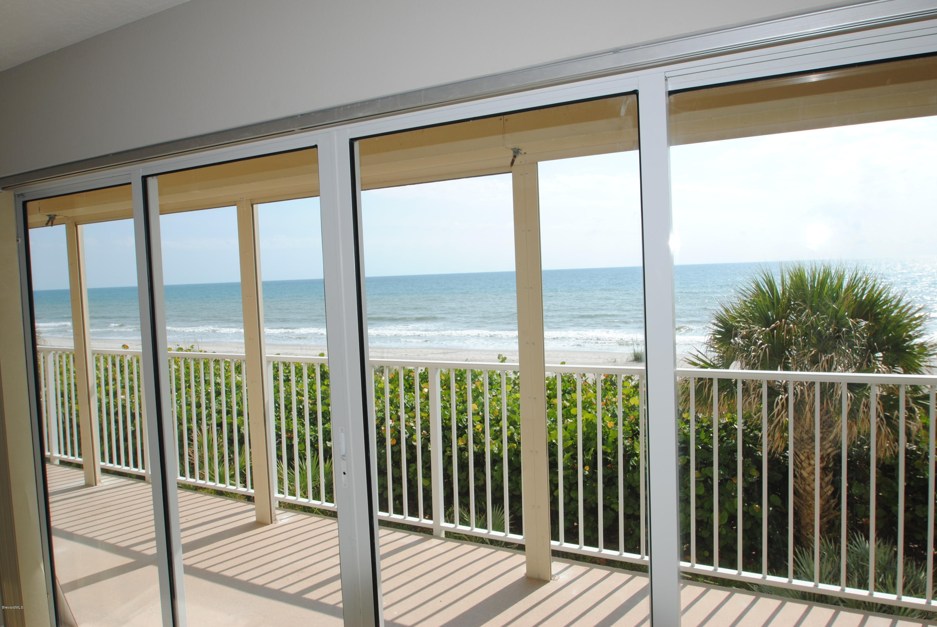 1095 Highway A1a Indialantic, Unit 204 Indialantic, FL 32903 - Photo 6 of 18 a view of a balcony with wooden floor