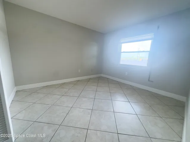 a view of a room that has a window in it