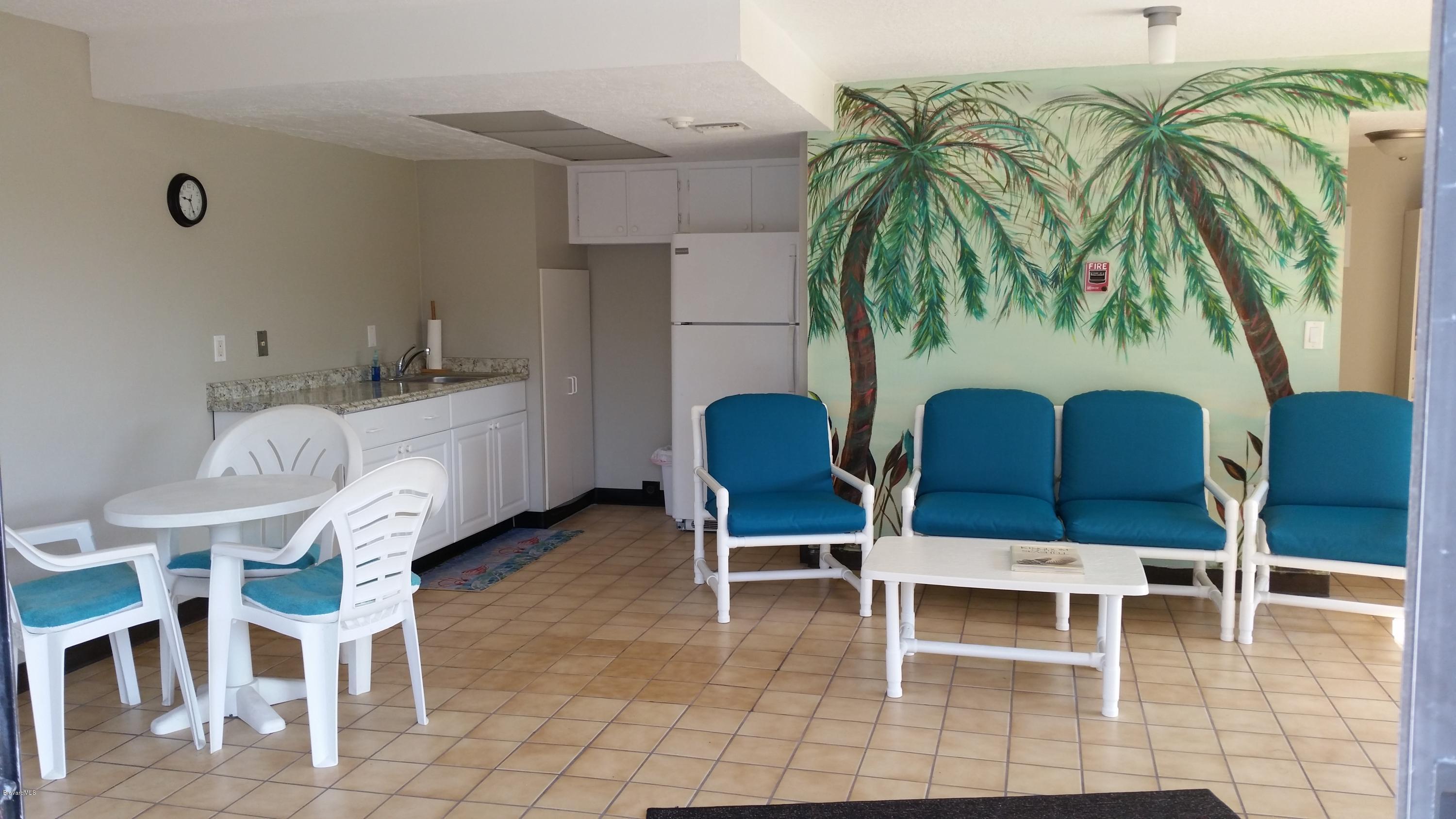 1095 Highway A1a Indialantic, Unit 204 Indialantic, FL 32903 - Photo 10 of 18 a dining room with furniture and a potted plant