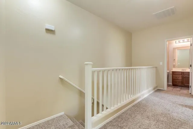 a view of empty room with a fireplace