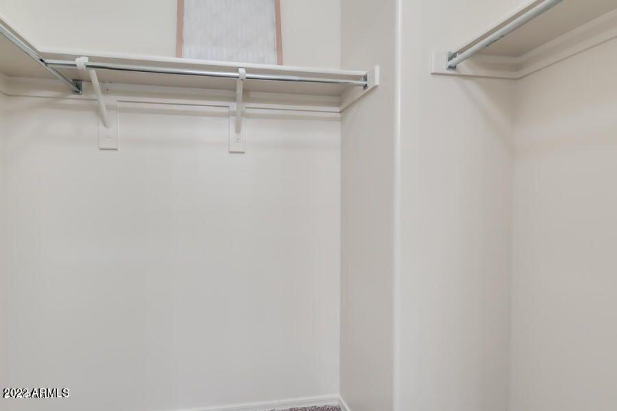 4750 East Thunderheart Trail, Unit 102 Gilbert, AZ 85297 - Photo 19 of 25 a view of walk in closet