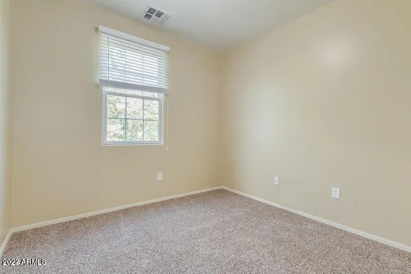 a bathroom with a sink toilet vanity and shower