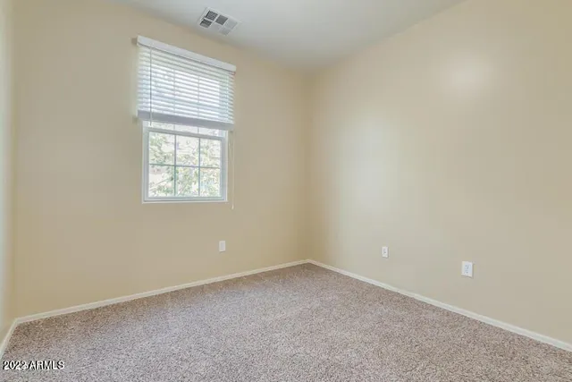 a bathroom with a sink toilet vanity and shower