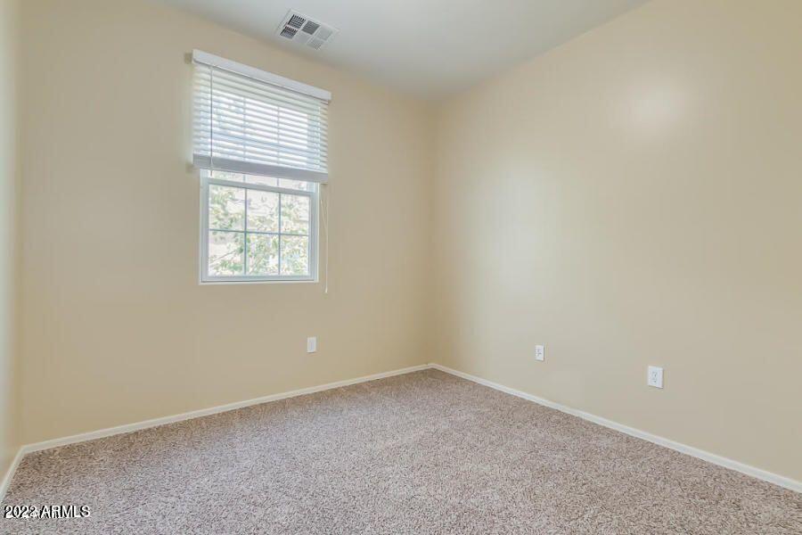 4750 East Thunderheart Trail, Unit 102 Gilbert, AZ 85297 - Photo 20 of 25 an empty room with a window