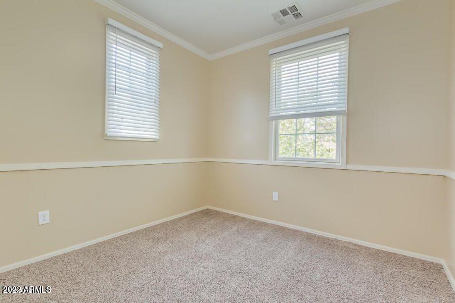 4750 East Thunderheart Trail, Unit 102 Gilbert, AZ 85297 - Photo 21 of 25 an empty room with a window