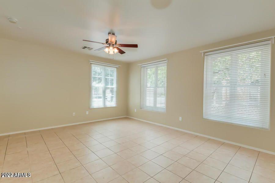 4750 East Thunderheart Trail, Unit 102 Gilbert, AZ 85297 - Photo 7 of 25 a view of an empty room with a window