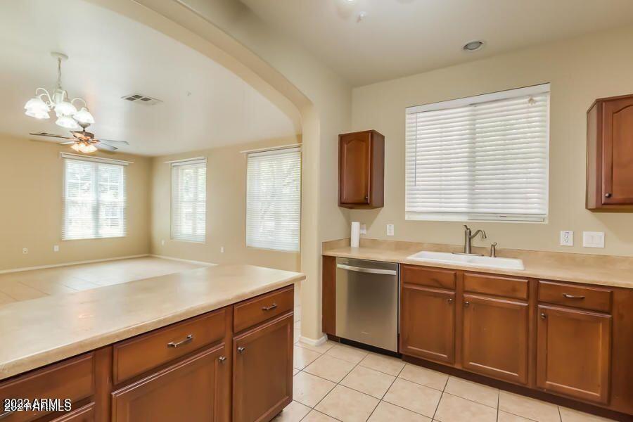 4750 East Thunderheart Trail, Unit 102 Gilbert, AZ 85297 - Photo 10 of 25 a kitchen with a sink and cabinets