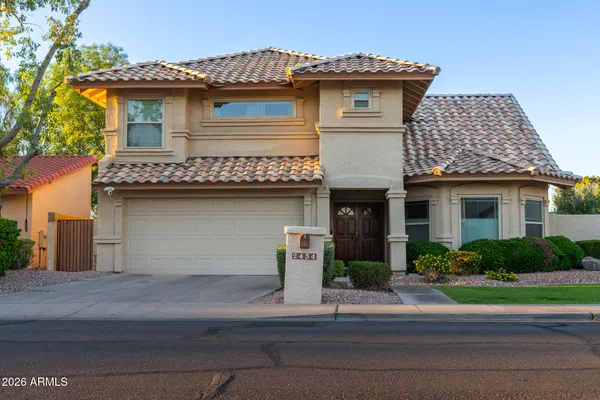 a front view of a house with a garage