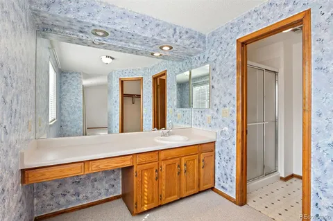 a bathroom with a sink a mirror and a bathtub
