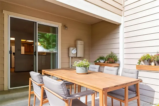 a dining room with a table and chairs