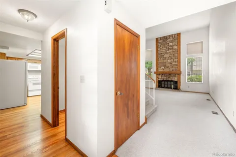 a view of empty room with furniture and wooden floor