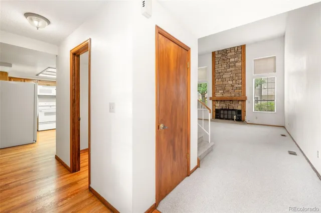 a view of empty room with furniture and wooden floor