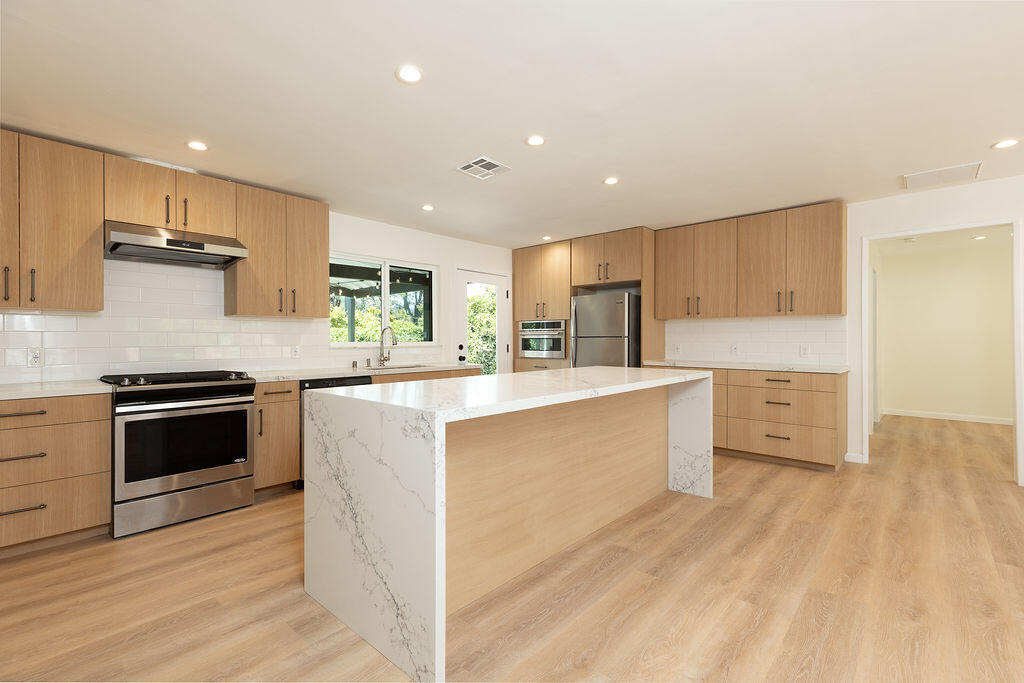 24 Pine Drive Santa Barbara, CA 93105 - Photo 1 of 45 a kitchen with stainless steel appliances granite countertop a stove a sink and a refrigerator