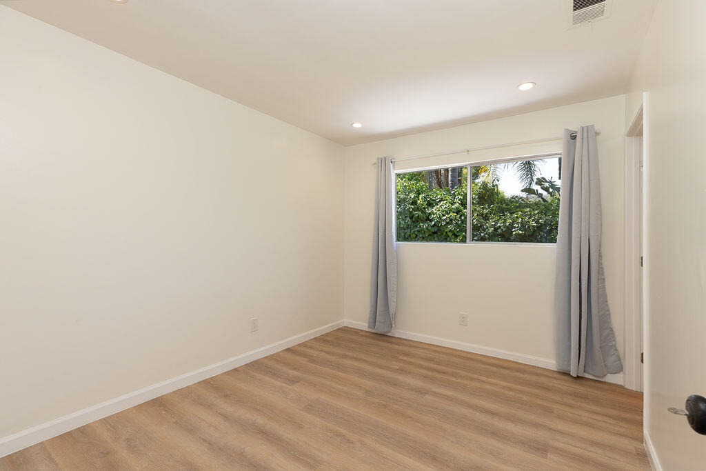 24 Pine Drive Santa Barbara, CA 93105 - Photo 23 of 45 an empty room with wooden floor and window