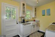2313 Eccleston Street Silver Spring, MD 20902 - Photo 3 of 13 a kitchen with a sink and cabinets