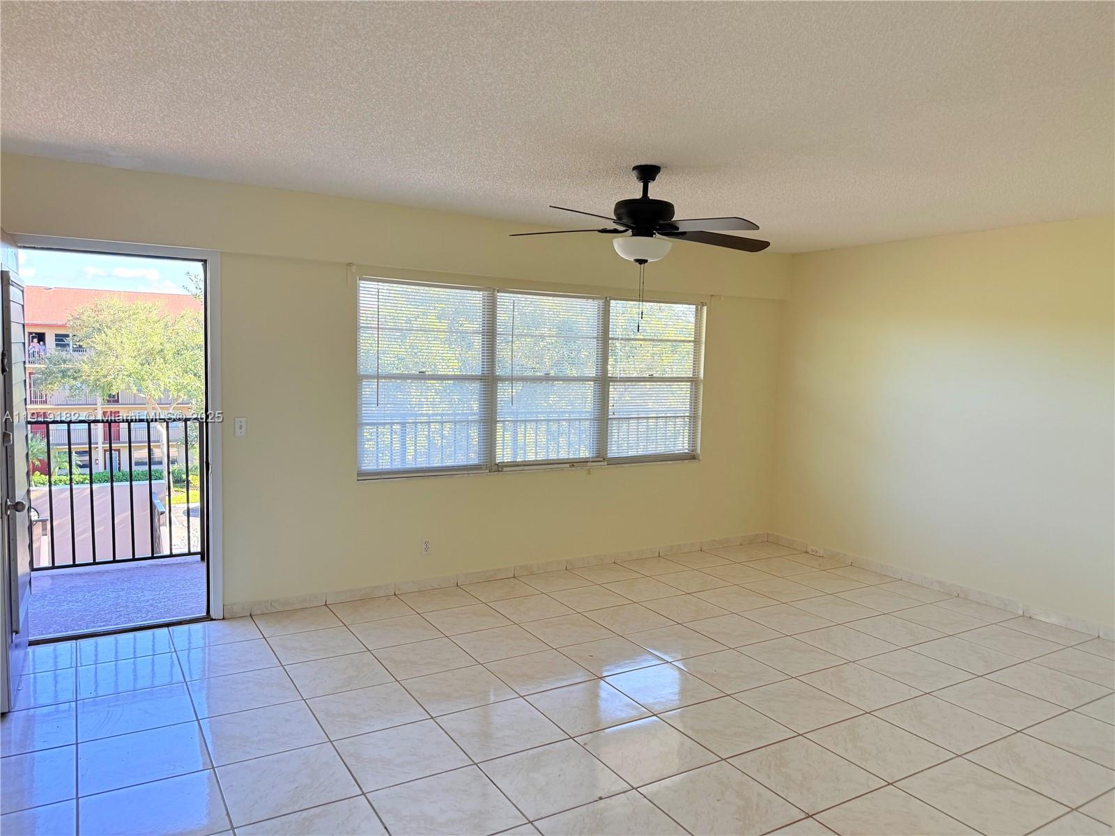 850 Southwest 133rd Terrace, Unit 416B Pembroke Pines, FL 33027 - Photo 3 of 13 a view of an empty room with a window