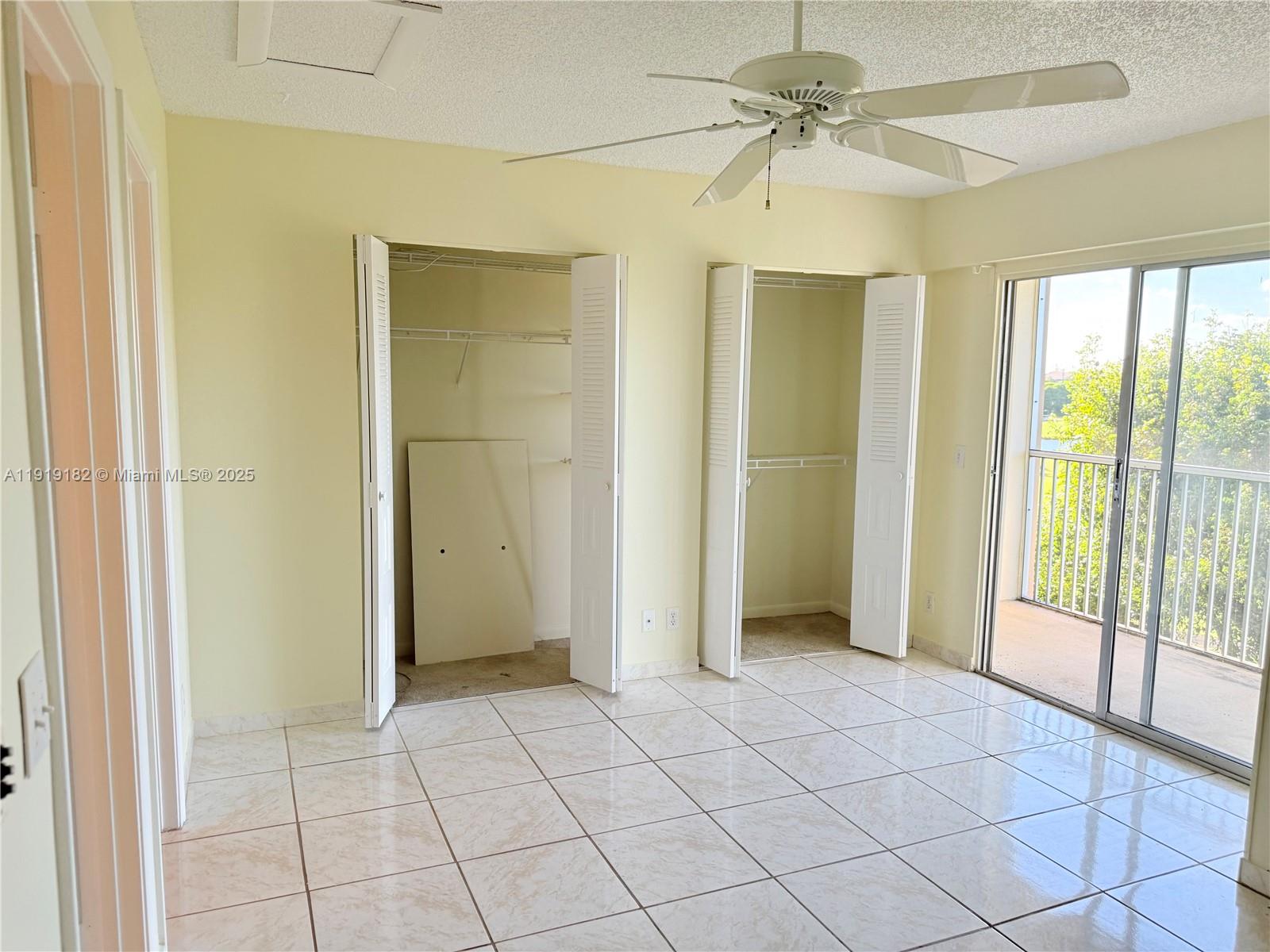 850 Southwest 133rd Terrace, Unit 416B Pembroke Pines, FL 33027 - Photo 10 of 13 a view of an empty room with a window