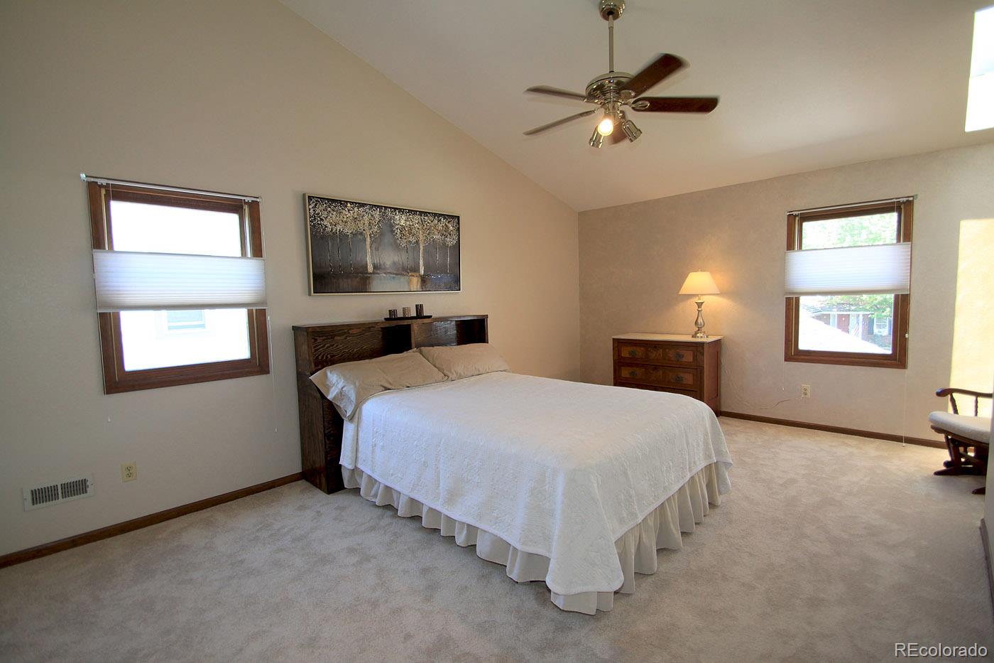 8198 Sweet Water Road Lone Tree, CO 80124 - Photo 12 of 23 a bedroom with a bed and window