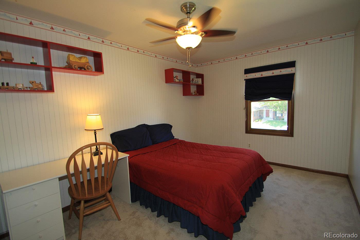 8198 Sweet Water Road Lone Tree, CO 80124 - Photo 17 of 23 a bedroom with a bed and a window