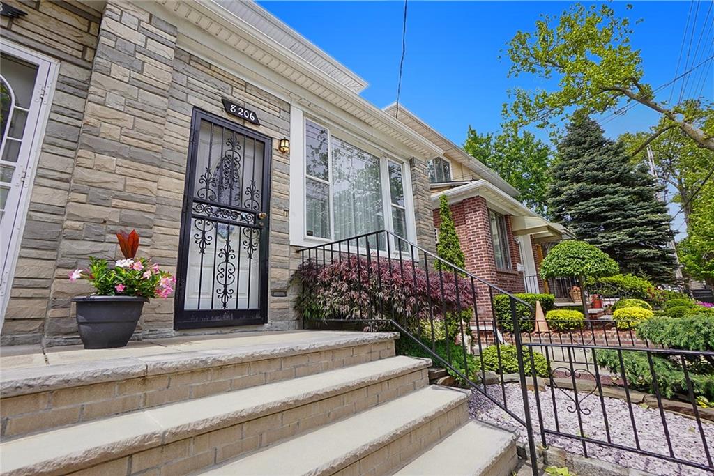 8206 10th Avenue Brooklyn, NY 11228 - Photo 1 of 32 a front view of a house with a garden