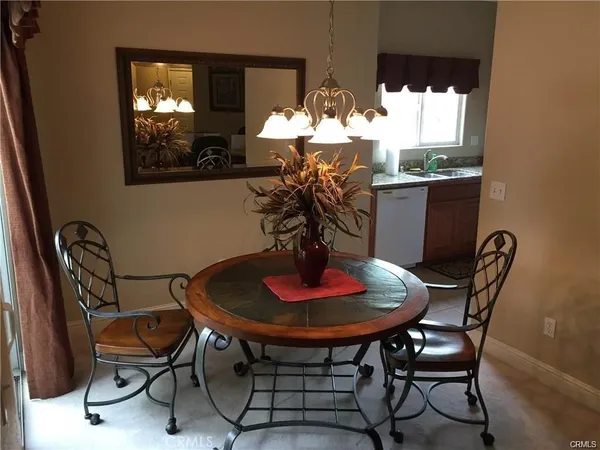 a kitchen with a stove a refrigerator and a sink