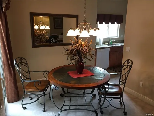 a kitchen with a stove a refrigerator and a sink