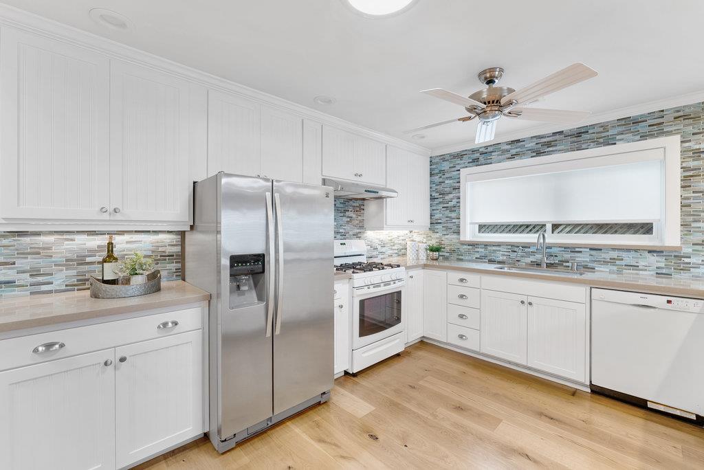 114 Bennett Road Aptos, CA 95003 - Photo 12 of 37 a kitchen with granite countertop stainless steel appliances a sink and cabinets