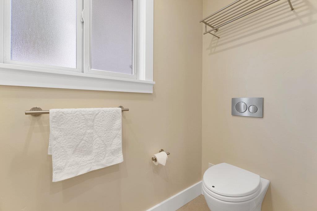 114 Bennett Road Aptos, CA 95003 - Photo 31 of 37 a white toilet sitting next to a bathroom sink