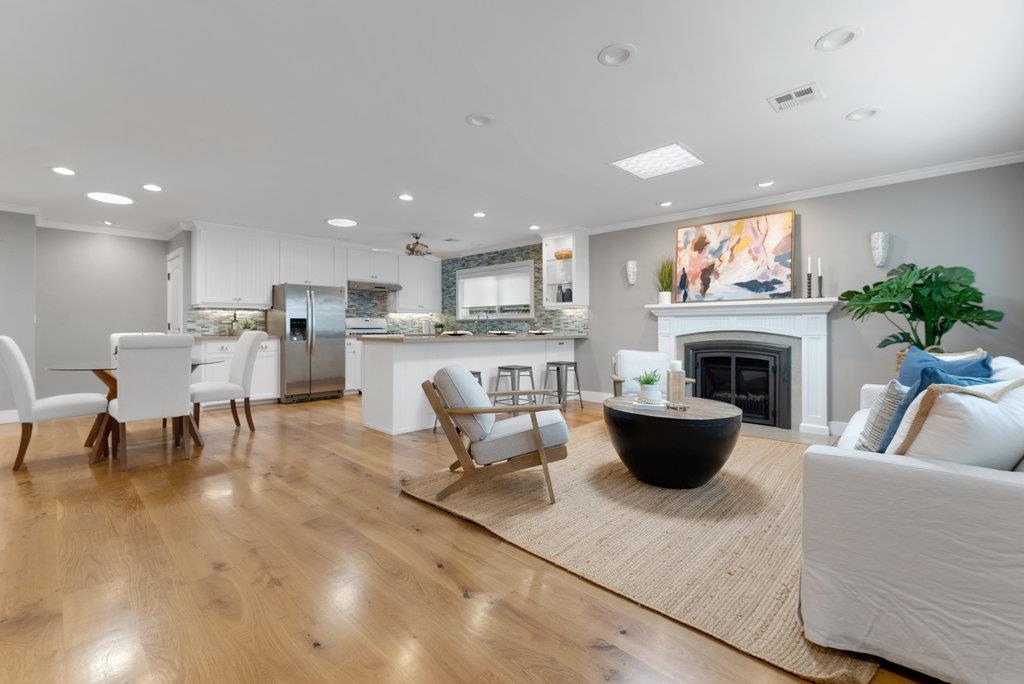 114 Bennett Road Aptos, CA 95003 - Photo 9 of 37 a living room with furniture a fireplace and a kitchen view
