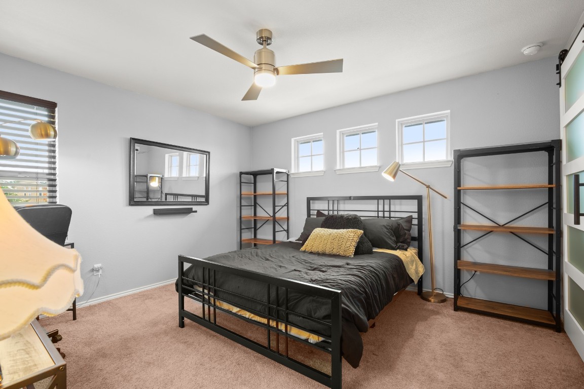 1006 Chad Loop Round Rock, TX 78665 - Photo 17 of 26 a bedroom with a bed window and a couch