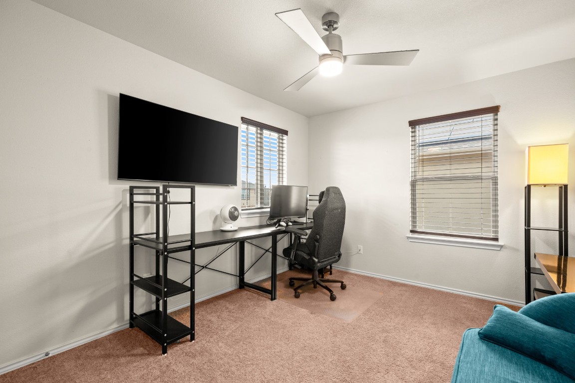 1006 Chad Loop Round Rock, TX 78665 - Photo 18 of 26 a view of a livingroom with workspace and a window