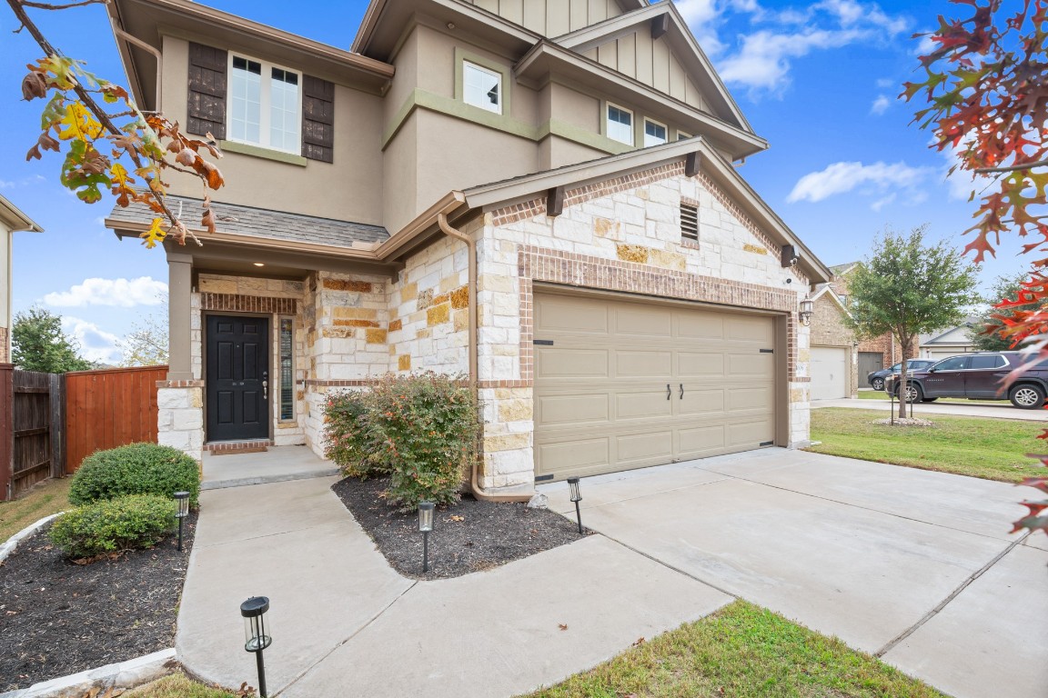 1006 Chad Loop Round Rock, TX 78665 - Photo 2 of 26 a view of a white house with a outdoor space