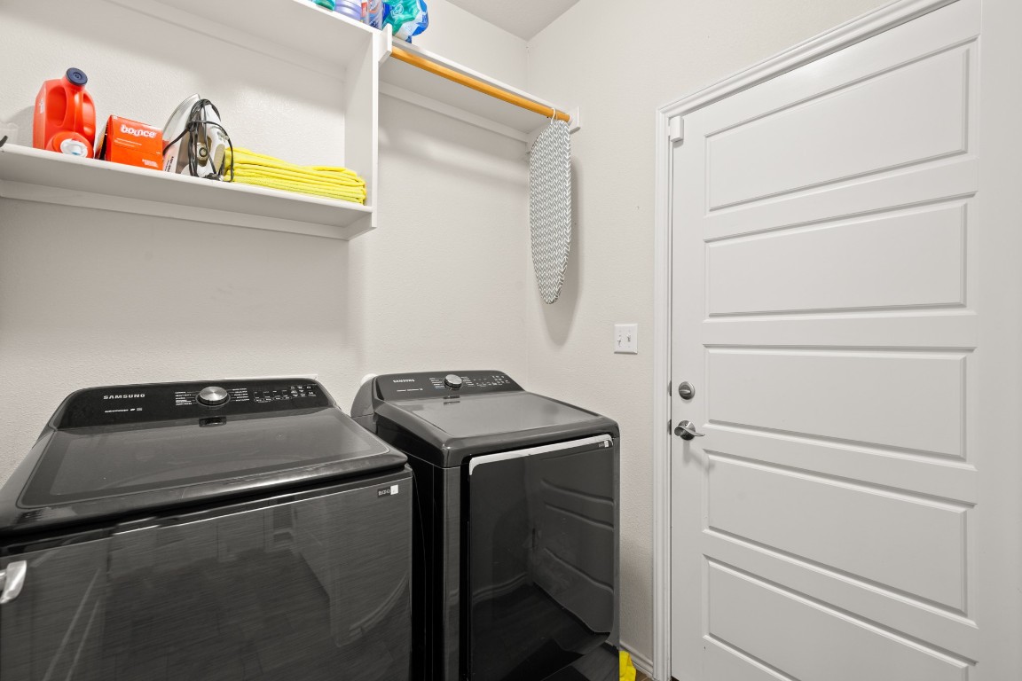 1006 Chad Loop Round Rock, TX 78665 - Photo 22 of 26 a utility room with dryer and washer