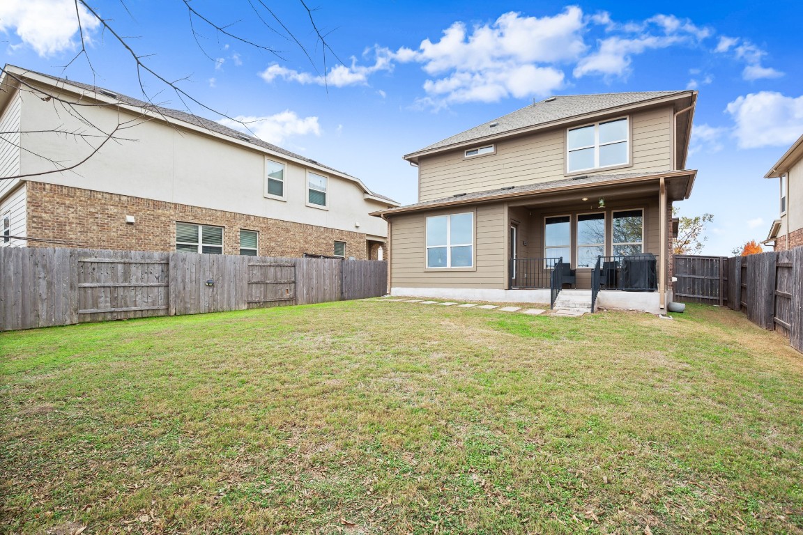 1006 Chad Loop Round Rock, TX 78665 - Photo 24 of 26 a view of a house with backyard and porch