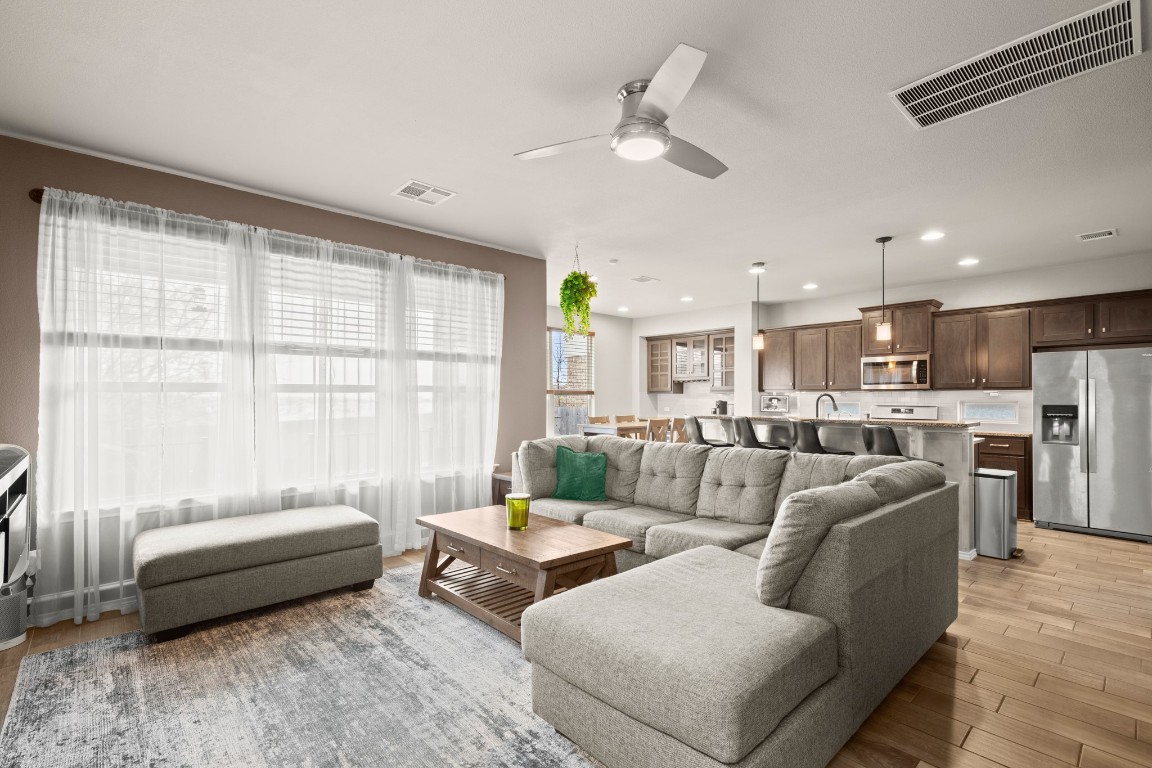 1006 Chad Loop Round Rock, TX 78665 - Photo 7 of 26 a living room with furniture and a large window