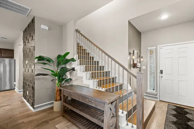 a view of entryway with wooden floor and a potted plant
