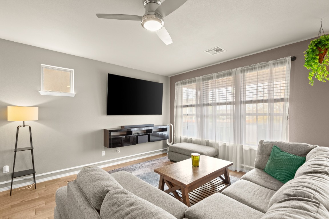 1006 Chad Loop Round Rock, TX 78665 - Photo 10 of 26 a living room with furniture and a flat screen tv