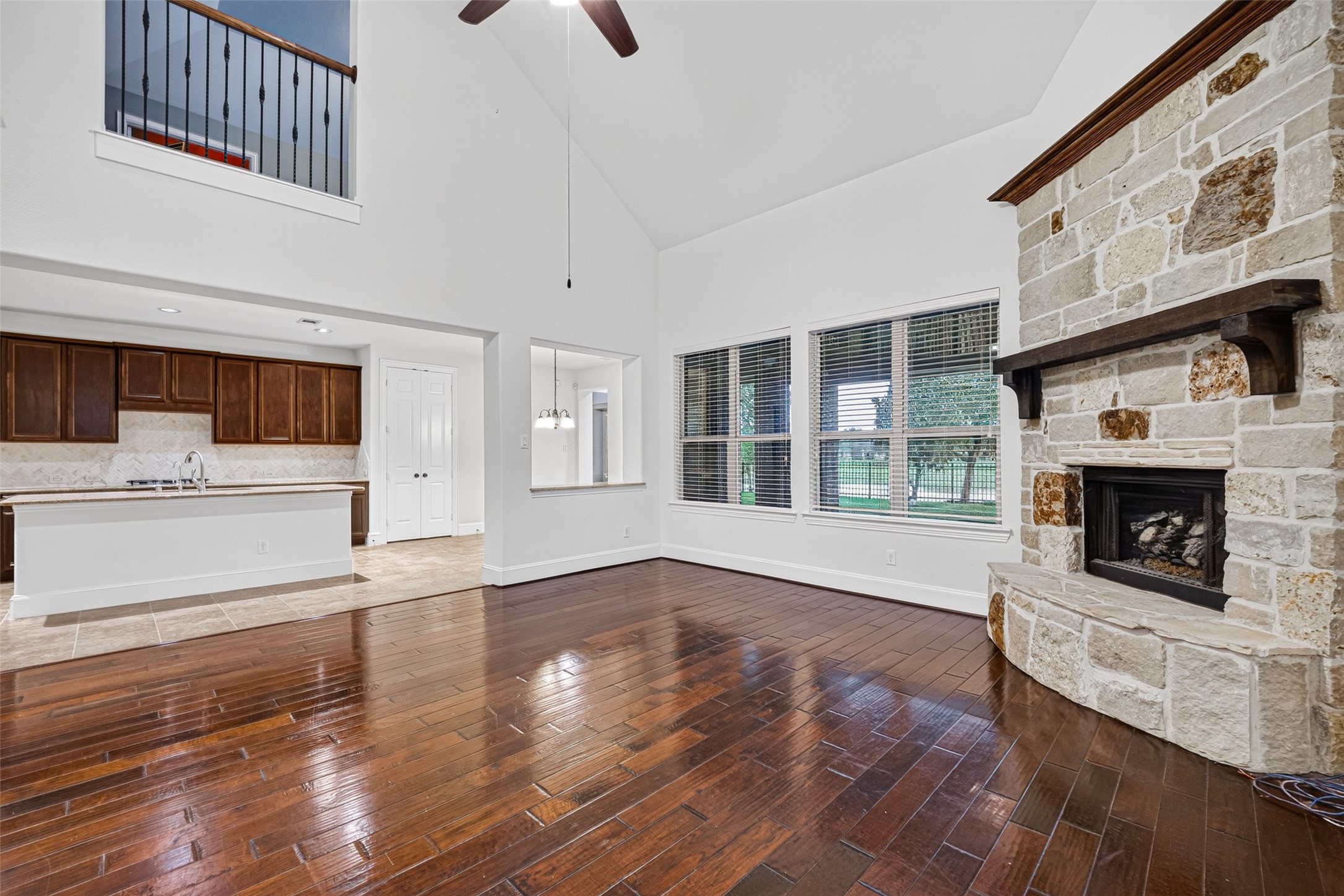 7930 Summer Night Lane Rosenberg, TX 77469 - Photo 11 of 48 Spacious living room featuring a floor-to-ceiling stone fireplace, and soaring ceilings.