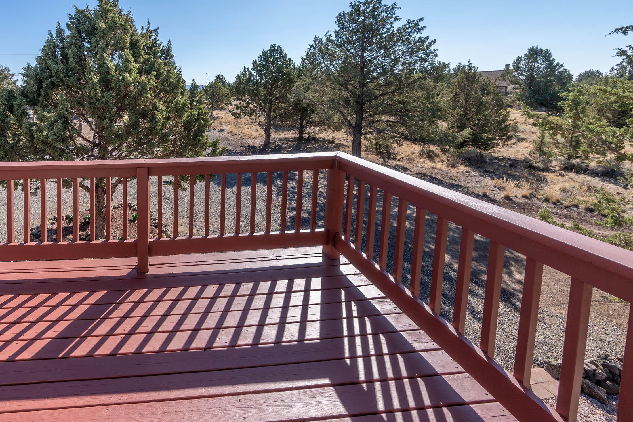 7271 Southwest Onyx Road Terrebonne, OR 97760 - Photo 28 of 43 Freshly finished wood balcony with railings.
